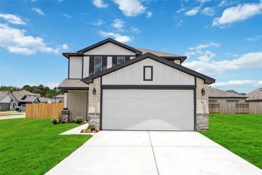 Front exterior of a new home in The Villages at Westpointe, Dayton, TX, highlighting curb appeal (Image 1).