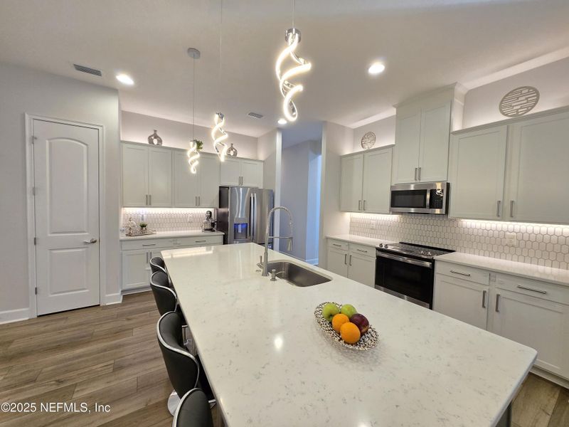 Furnished interior view inside a new home in Sandy Creek, St. Augustine (Image 13).