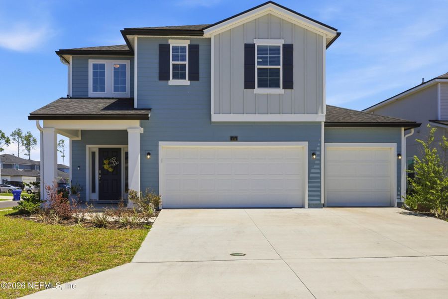 Front exterior of a new home in Cordova Palms, St. Augustine, FL, highlighting curb appeal (Image 2). Front exterior of a new home in Cordova Palms, St. Augustine, FL, highlighting curb appeal (Image 2).