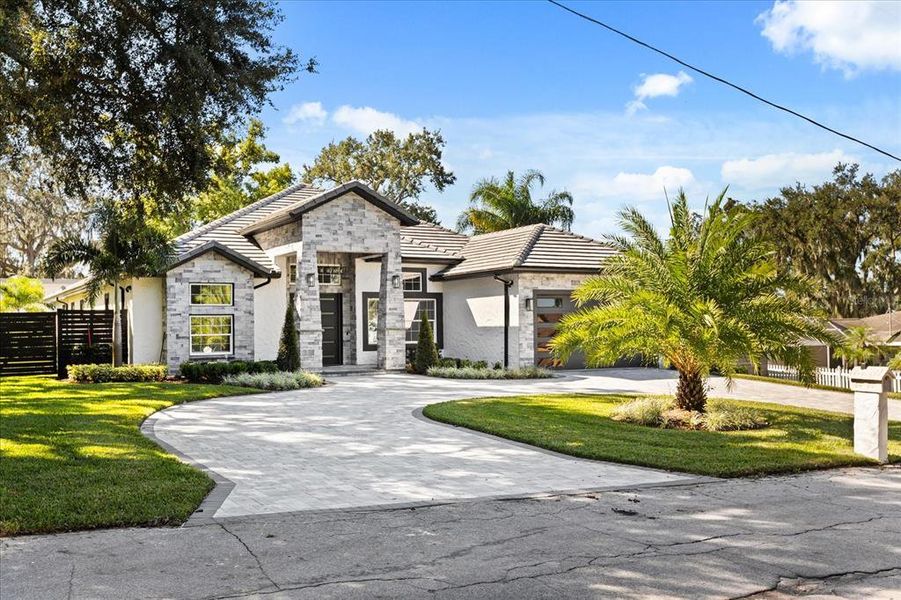 Front exterior of a new home in , Clermont, FL, highlighting curb appeal (Image 30). Front exterior of a new home in , Clermont, FL, highlighting curb appeal (Image 30).