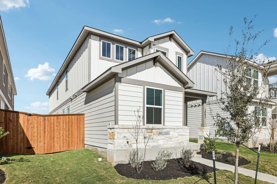 A white house with a fence.