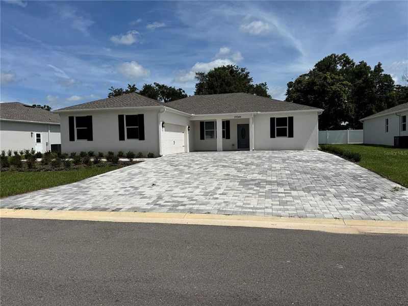 Front exterior of a new home in , Dade City, FL, highlighting curb appeal (Image 32).