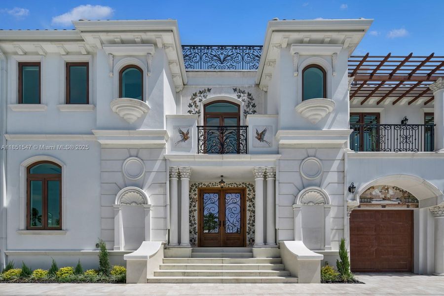 Front exterior of a new home in , Surfside, FL, highlighting curb appeal (Image 1).