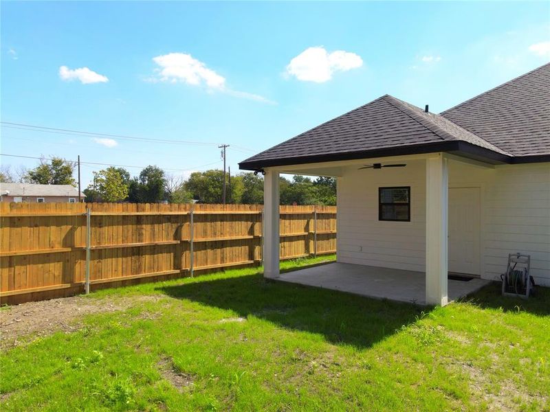 View of yard featuring a ceiling fan and a patio View of yard featuring a ceiling fan and a patio