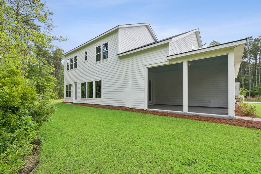 Exterior details and patio area of a home in Hidden Ponds Reserve, Awendaw (Image 16).