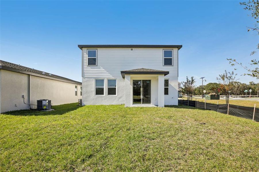 Exterior details and patio area of a home in The Reserve at Hammock Oaks - Classic Series, Lady Lake (Image 27).
