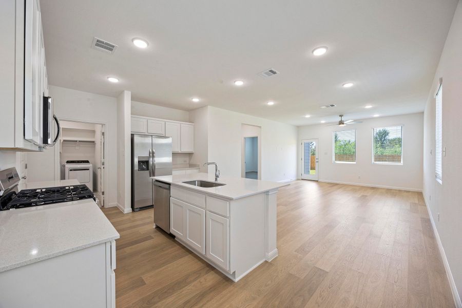 Kitchen in the Magnolia home plan by Trophy Signature Homes – REPRESENTATIVE PHOTO