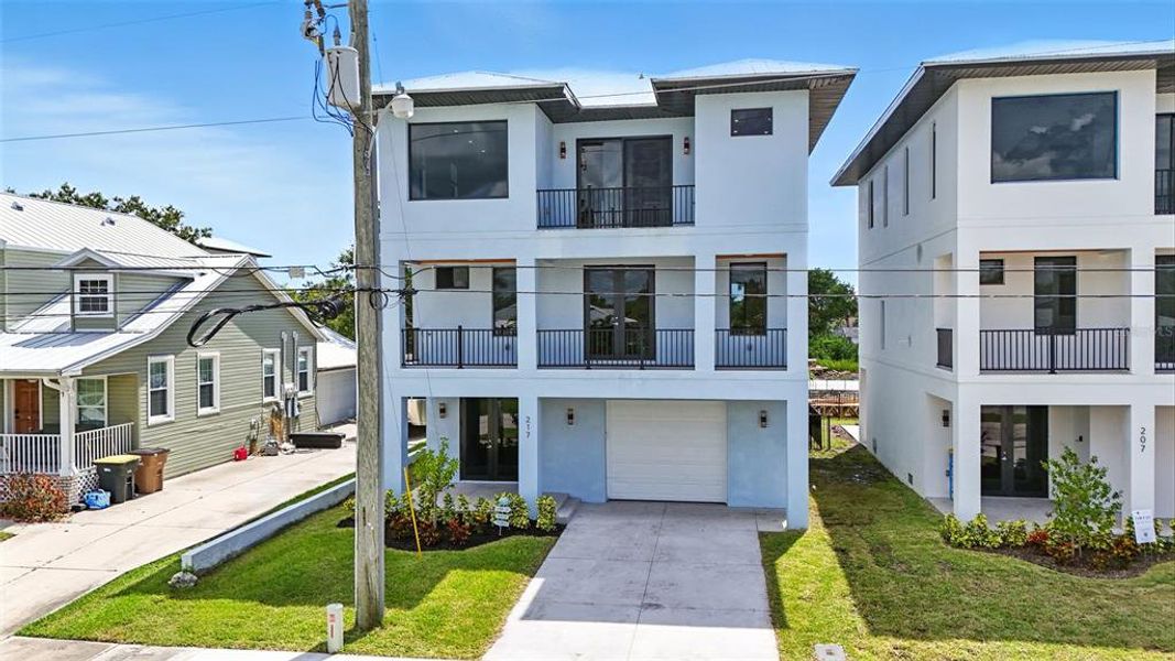 Front exterior of a new home in , Punta Gorda, FL, highlighting curb appeal (Image 24).
