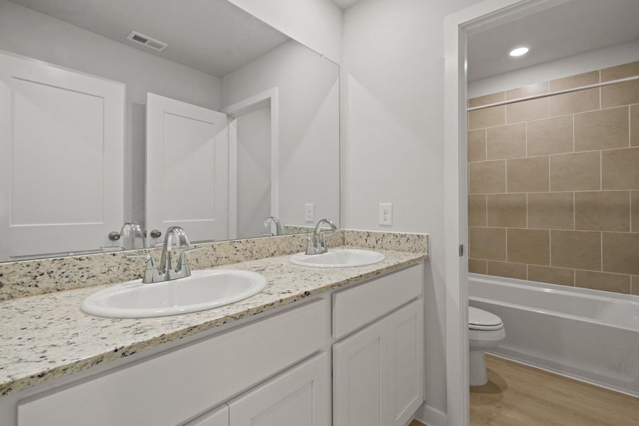 Furnished interior view inside a new home in Sherwood Glen, Conroe (Image 4).