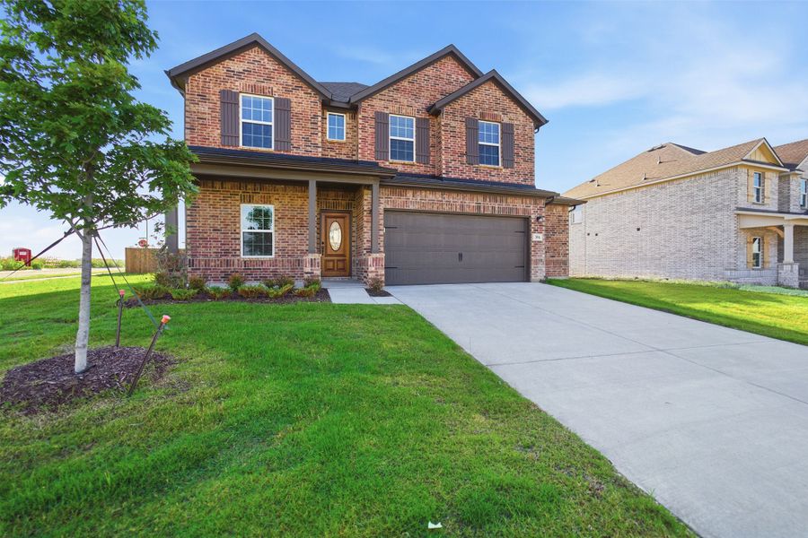 Front exterior of a new home in Saddlebrook Estates, Waxahachie, TX, highlighting curb appeal (Image 26).