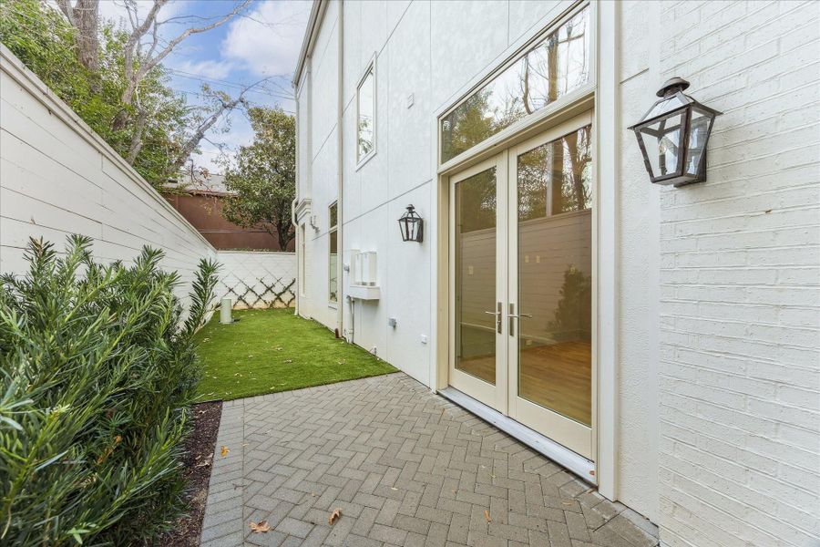 French doors off of the office open to side yard that connects to back yard, which maximizes usability or outdoor areas.