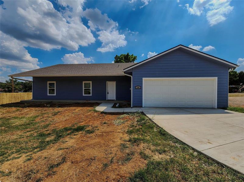 Front exterior of a new home in , Kennedale, TX, highlighting curb appeal (Image 17).
