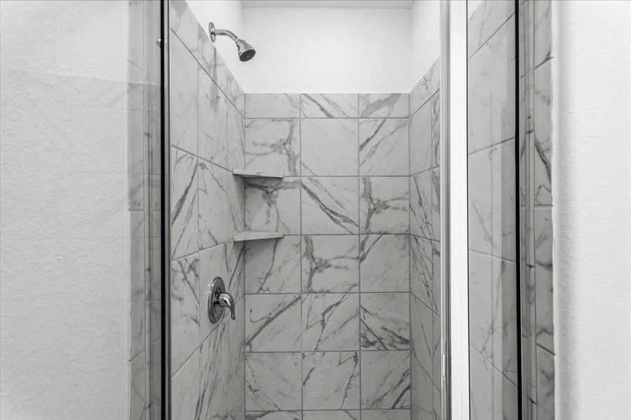 Full bathroom featuring a marble finish shower