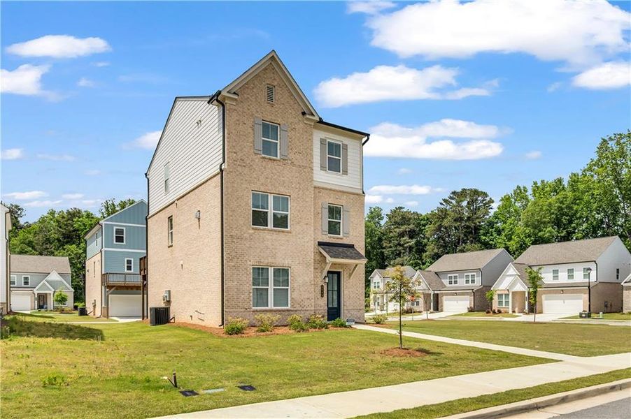 Front exterior of a new home in , Lawrenceville, GA, highlighting curb appeal (Image 26).