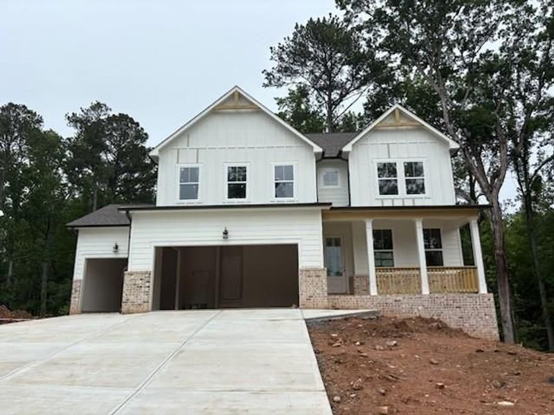Front exterior of a new home in Riverwood, Dallas, GA, highlighting curb appeal (Image 84). Front exterior of a new home in Riverwood, Dallas, GA, highlighting curb appeal (Image 84).