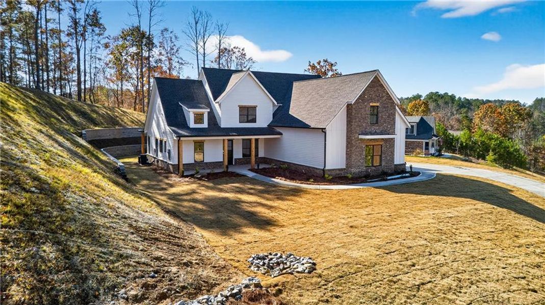 Front exterior of a new home in , Canton, GA, highlighting curb appeal (Image 16). Front exterior of a new home in , Canton, GA, highlighting curb appeal (Image 16).