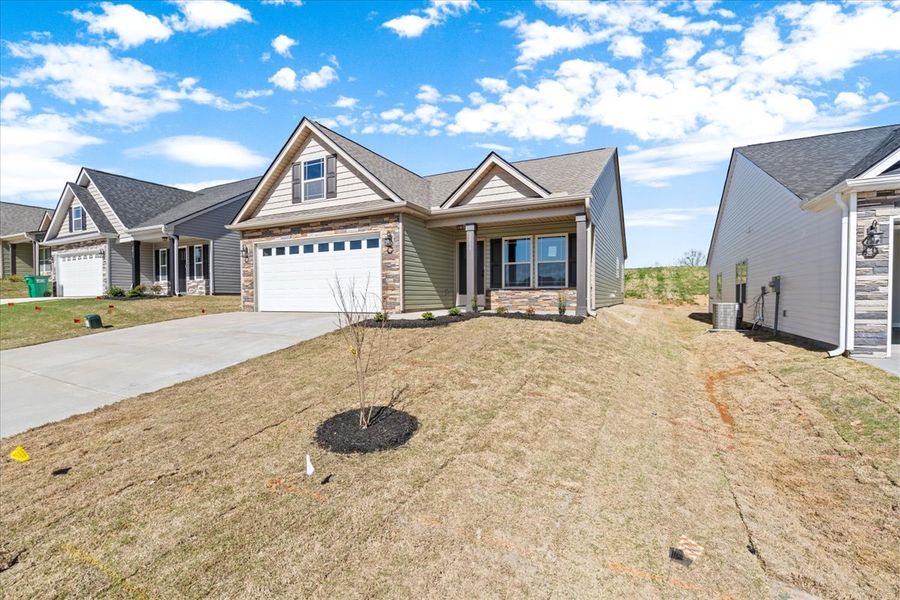 Representative exterior photo of a completed home built from the Wellford by Enchanted Homes in Hampshire Heights, Moore, SC (Image 22).