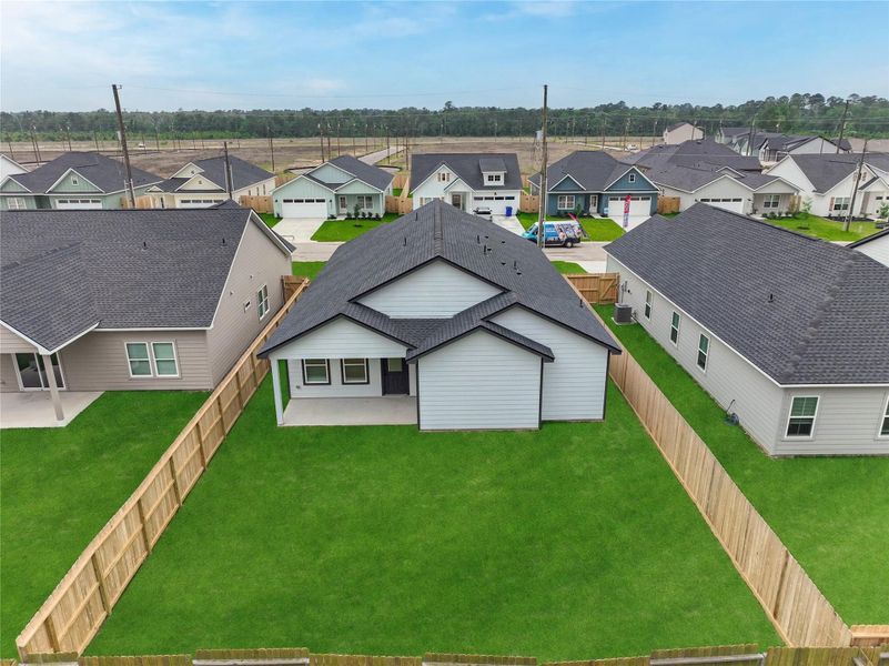 Exterior details and patio area of a home in Hill & Dale Ranch, Splendora (Image 22).