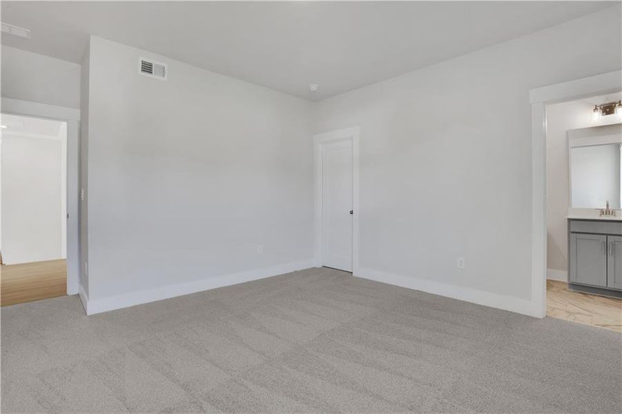 Spacious, unfurnished interior of a new home in The Paddocks at Doc Hughes, Buford (Image 22).