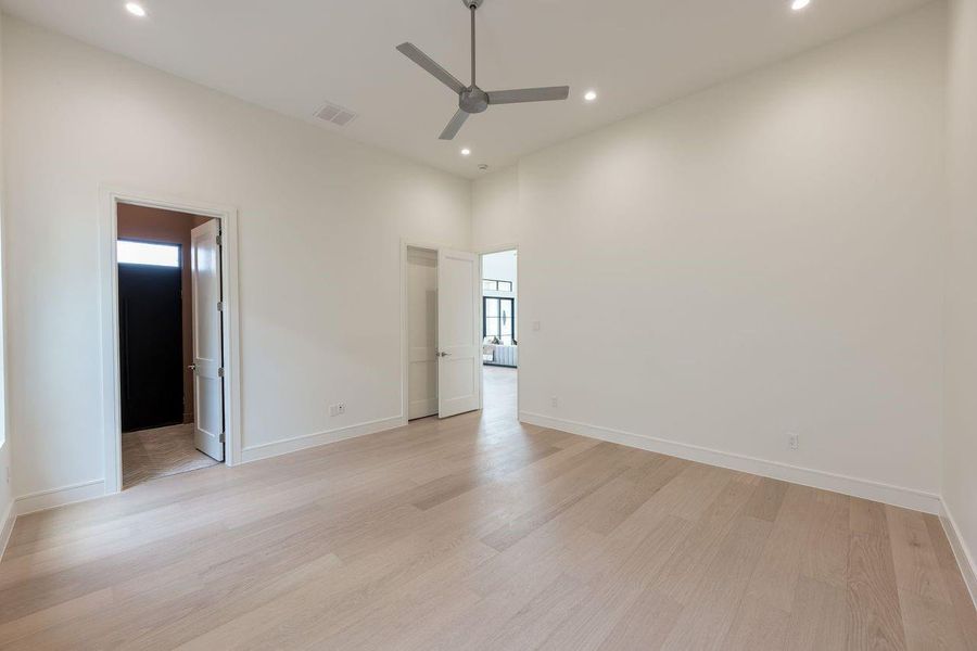 Designed with the same attention to detail found throughout the home, this light-filled space balances scale with serenity. Tall ceilings and understated finishes create a quiet backdrop one that feels equally suited for focused mornings, restful afternoons, and slow evenings at home.