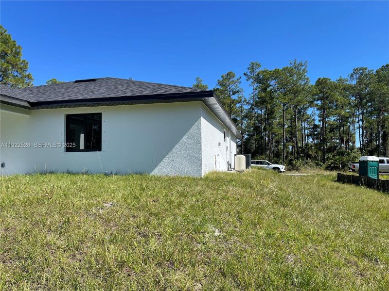 Exterior details and patio area of a home in , Lehigh Acres (Image 24). Exterior details and patio area of a home in , Lehigh Acres (Image 24).