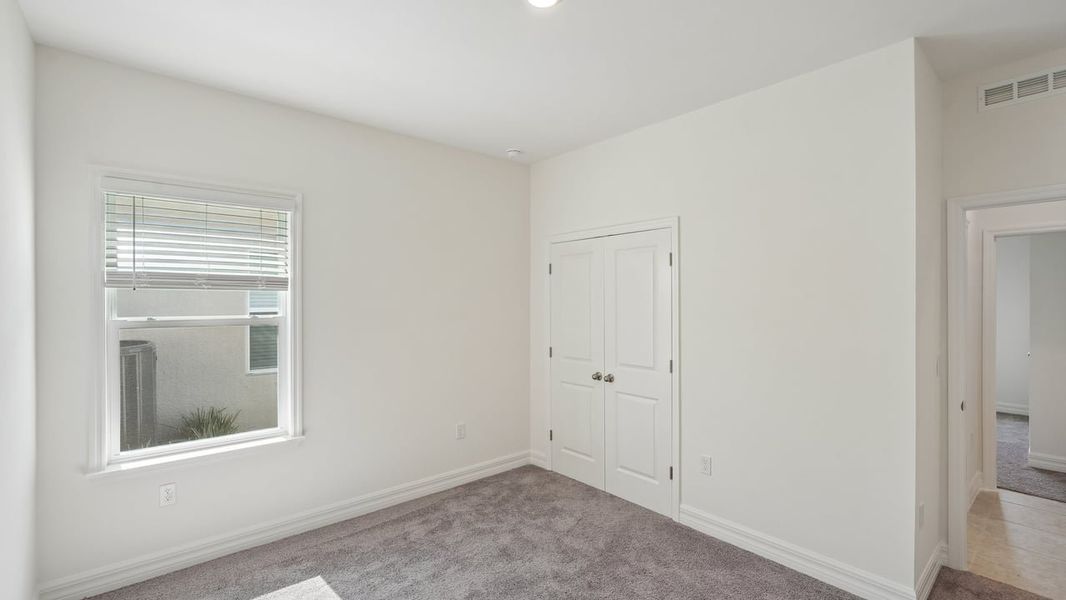 Spacious, unfurnished interior of a new home in Heritage Station, Punta Gorda (Image 41).