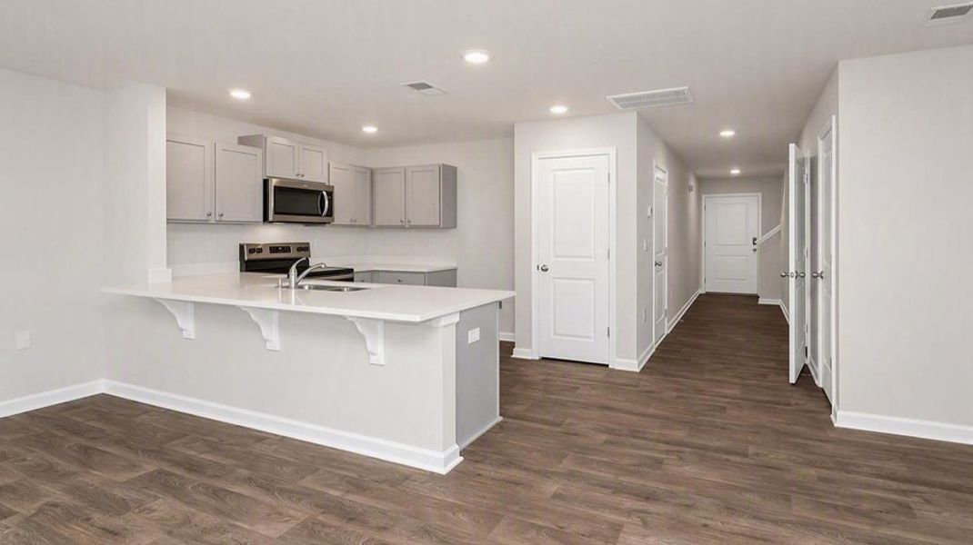 Furnished interior view inside a new home in Hunter's Branch Townhomes, Hopkins (Image 4). Furnished interior view inside a new home in Hunter's Branch Townhomes, Hopkins (Image 4).