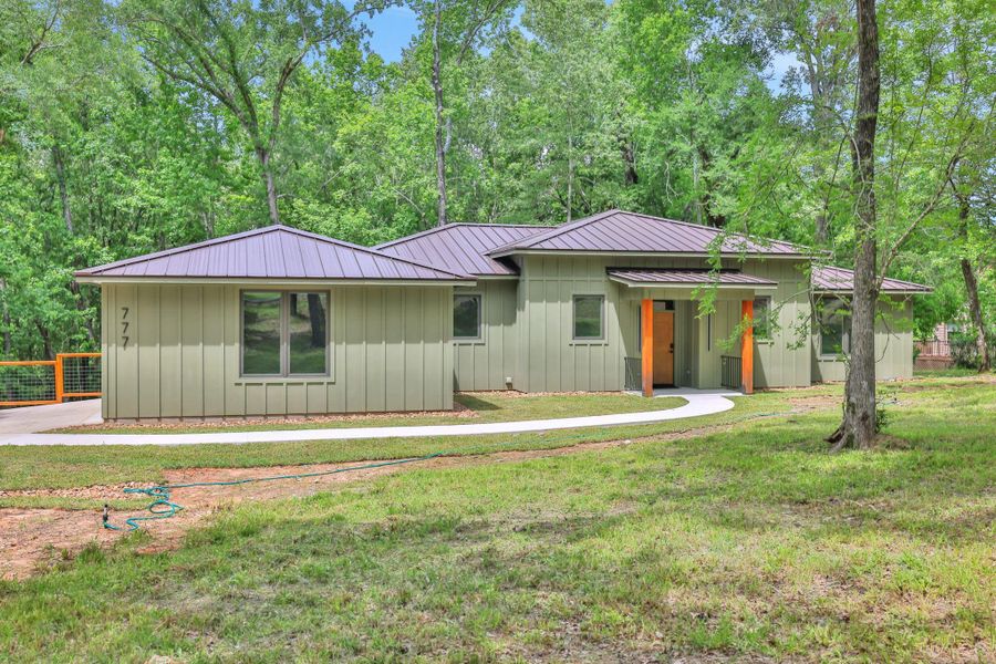 This never lived in, brand new construction has a striking front entry with warm wood accents