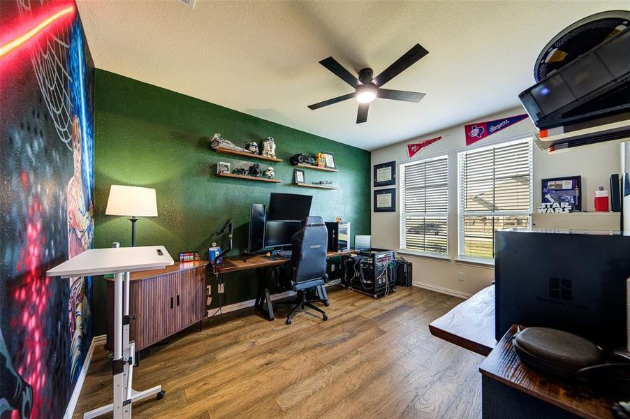 Home office featuring wood finished floors and ceiling fan