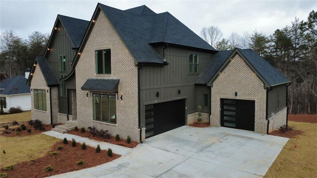 Front exterior of a new home in , Gainesville, GA, highlighting curb appeal (Image 5). Front exterior of a new home in , Gainesville, GA, highlighting curb appeal (Image 5).