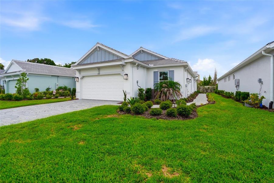 Front exterior of a new home in , Wesley Chapel, FL, highlighting curb appeal (Image 1). Front exterior of a new home in , Wesley Chapel, FL, highlighting curb appeal (Image 1).