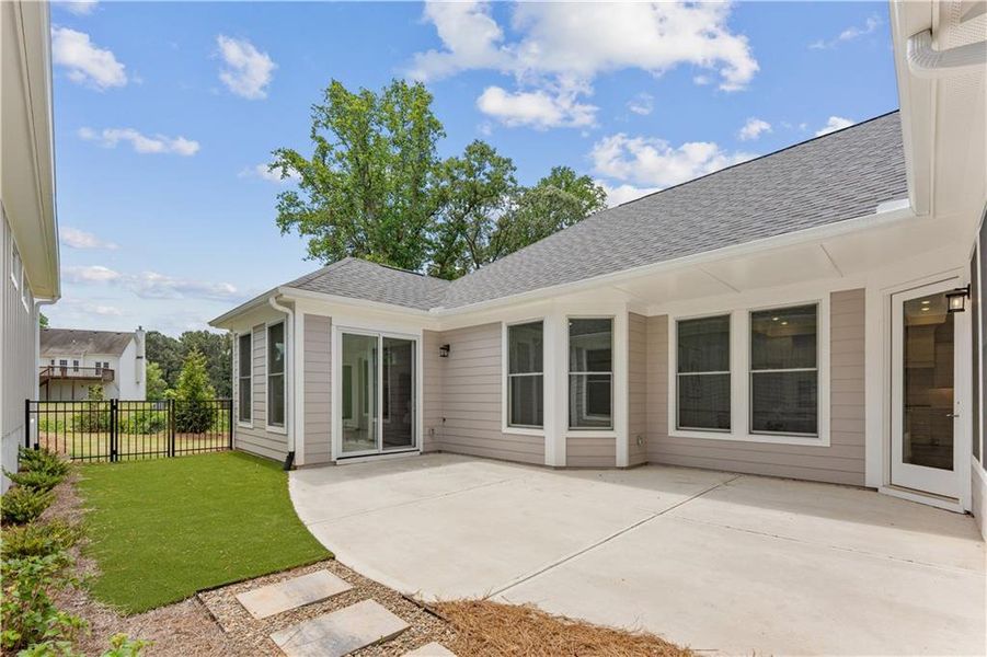Exterior details and patio area of a home in The Courtyards at Bailey Farms, Dacula (Image 4).
