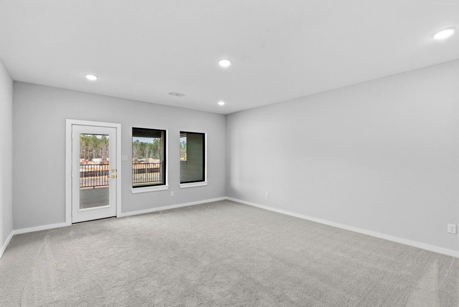 Upstairs game room with door to the large balcony