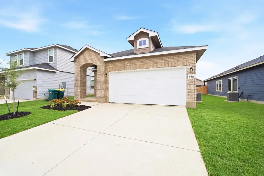 Front exterior of a new home in Notting Hill, Converse, TX, highlighting curb appeal (Image 18).