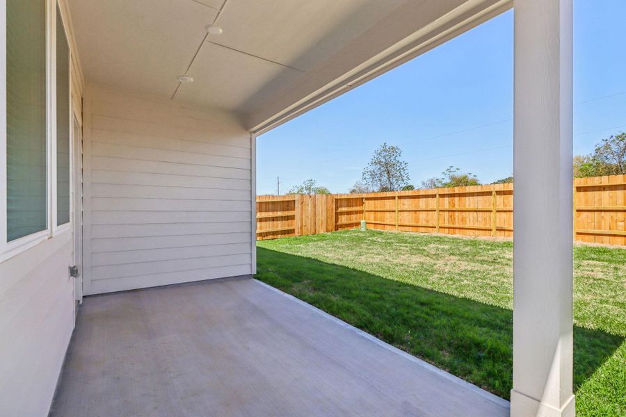 Exterior details and patio area of a home in Sanford Farms - Traditional Series, Conroe (Image 3).