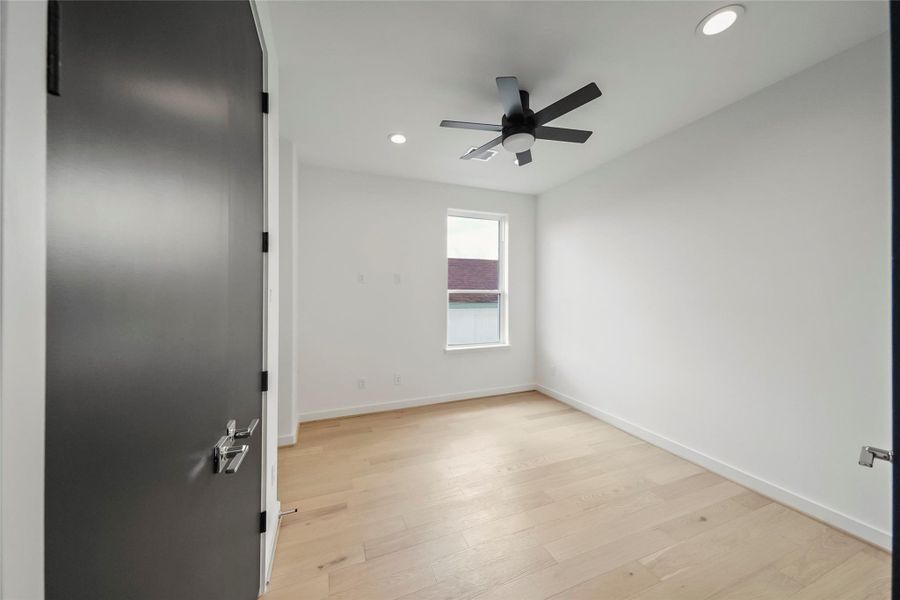 Sleek and contemporary bedroom with a stylish ceiling fan, one of three cozy retreats in your new home. Sleek and contemporary bedroom with a stylish ceiling fan, one of three cozy retreats in your new home.