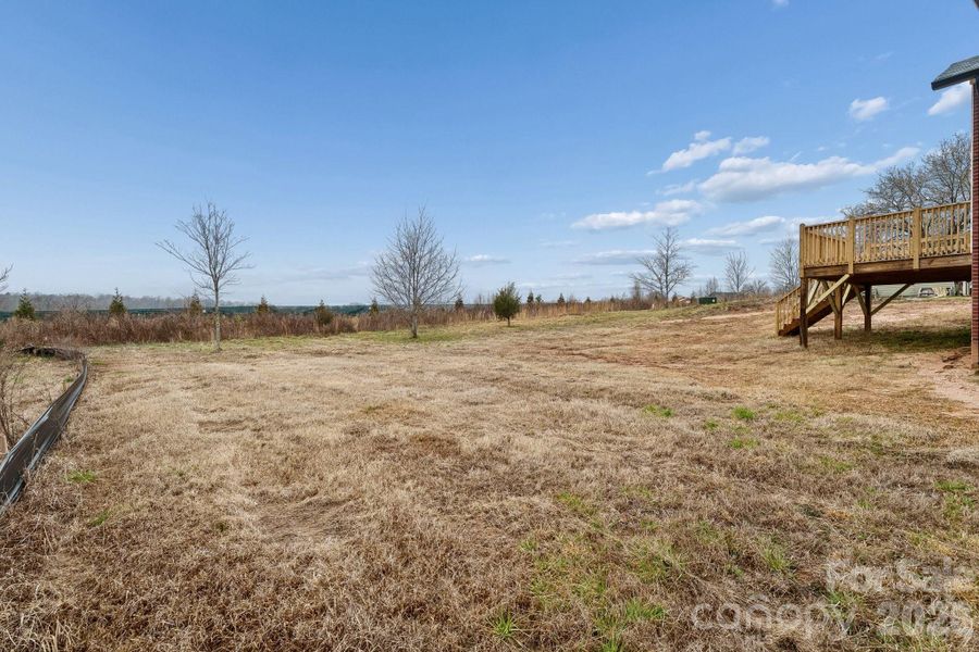 large rear yard with abundance of sunlight makes for a great space for gardening, entertaining or creating your own haven