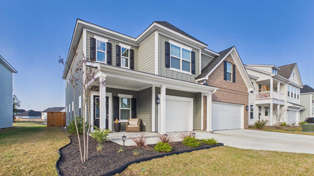 Front exterior of a new home in Hewing Farms, Summerville, SC, highlighting curb appeal (Image 25).