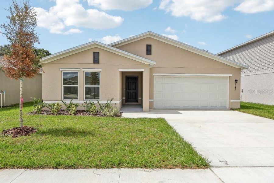Front exterior of a new home in Sumter Villas, Sumterville, FL, highlighting curb appeal (Image 1). Front exterior of a new home in Sumter Villas, Sumterville, FL, highlighting curb appeal (Image 1).