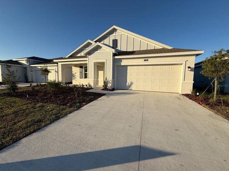 Front exterior of a new home in , Kissimmee, FL, highlighting curb appeal (Image 26).