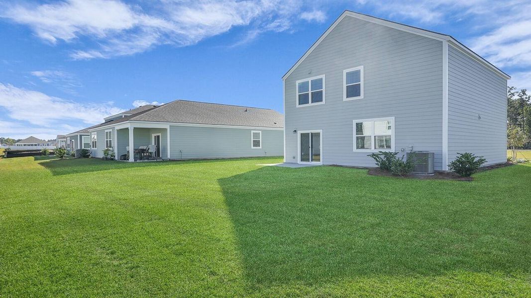 Exterior details and patio area of a home in Hillcrest, Ravenel (Image 2). Exterior details and patio area of a home in Hillcrest, Ravenel (Image 2).