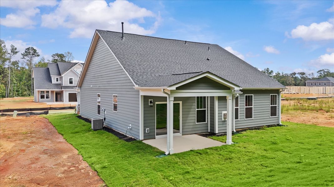 Warm and inviting outdoor living space with a covered rear porch and tasteful finishes