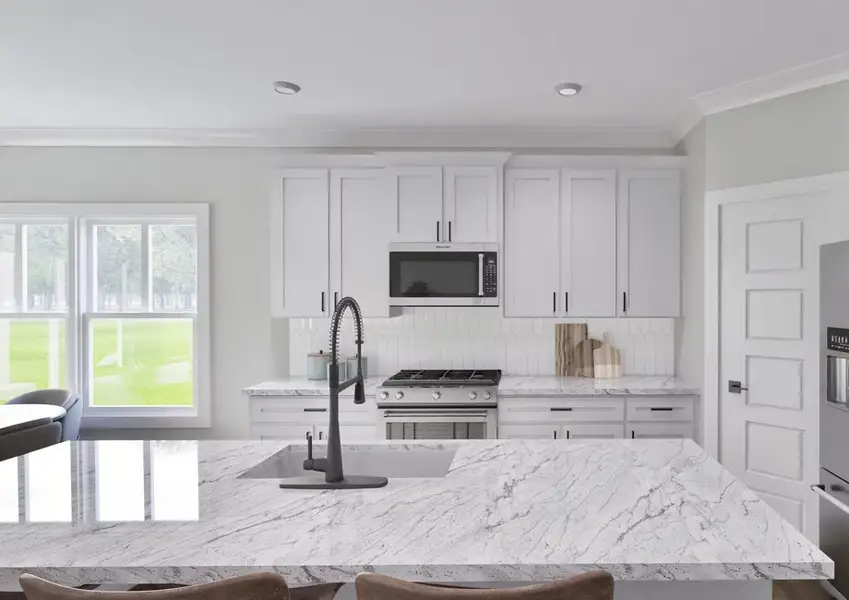 A modern kitchen featuring white cabinets and a sleek granite island, creating a bright and elegant cooking space.