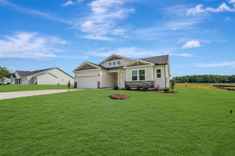 Front exterior of a new home in McAlister Creek, Clayton, NC, highlighting curb appeal (Image 16).