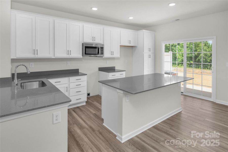 Magnolia Gourmet Kitchen w Oversized Island Magnolia Gourmet Kitchen w Oversized Island