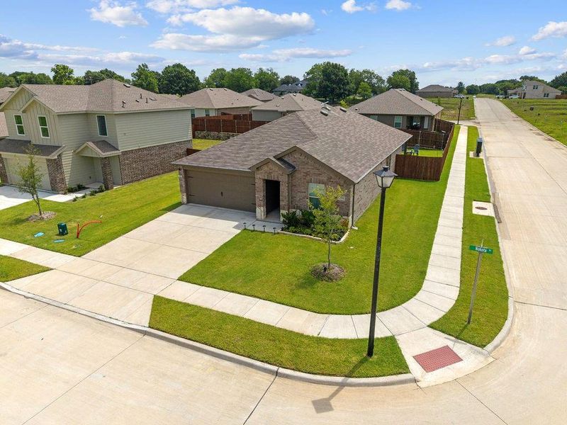 Front exterior of a new home in Leonard Crossing, Leonard, TX, highlighting curb appeal (Image 20).