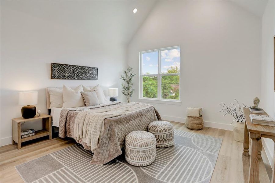 The 14x14 SF primary bedroom has a cathedral ceiling.