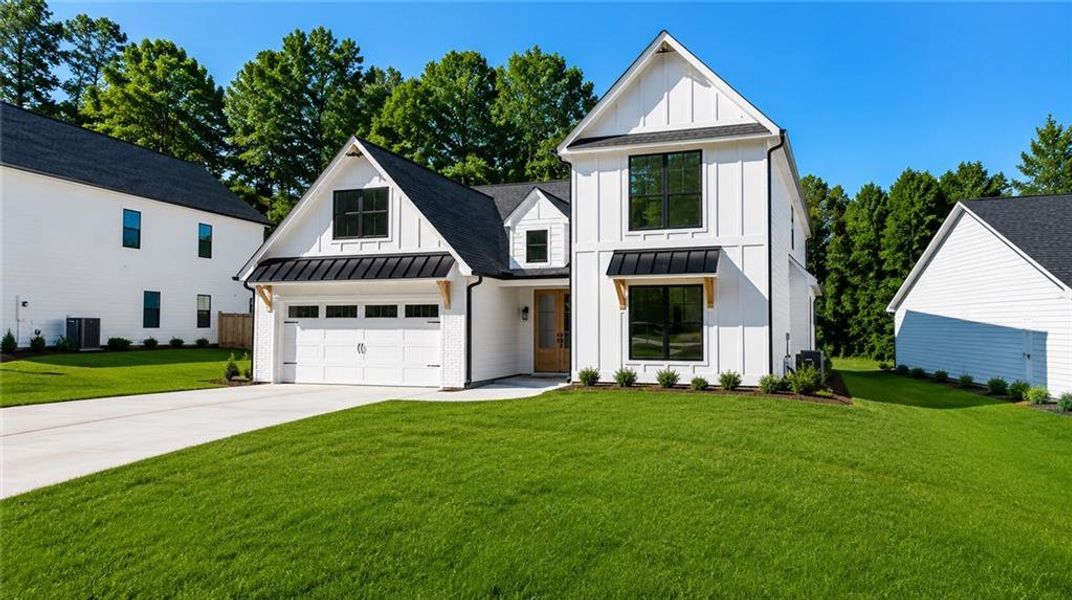 Front exterior of a new home in , Sugar Hill, GA, highlighting curb appeal (Image 2). Front exterior of a new home in , Sugar Hill, GA, highlighting curb appeal (Image 2).