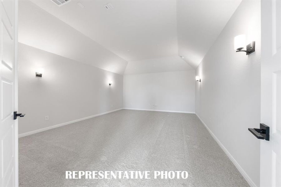 This spacious media room with adjacent game room create the ultimate family entertainment zone! REPRESENTATIVE PHOTO This spacious media room with adjacent game room create the ultimate family entertainment zone! REPRESENTATIVE PHOTO