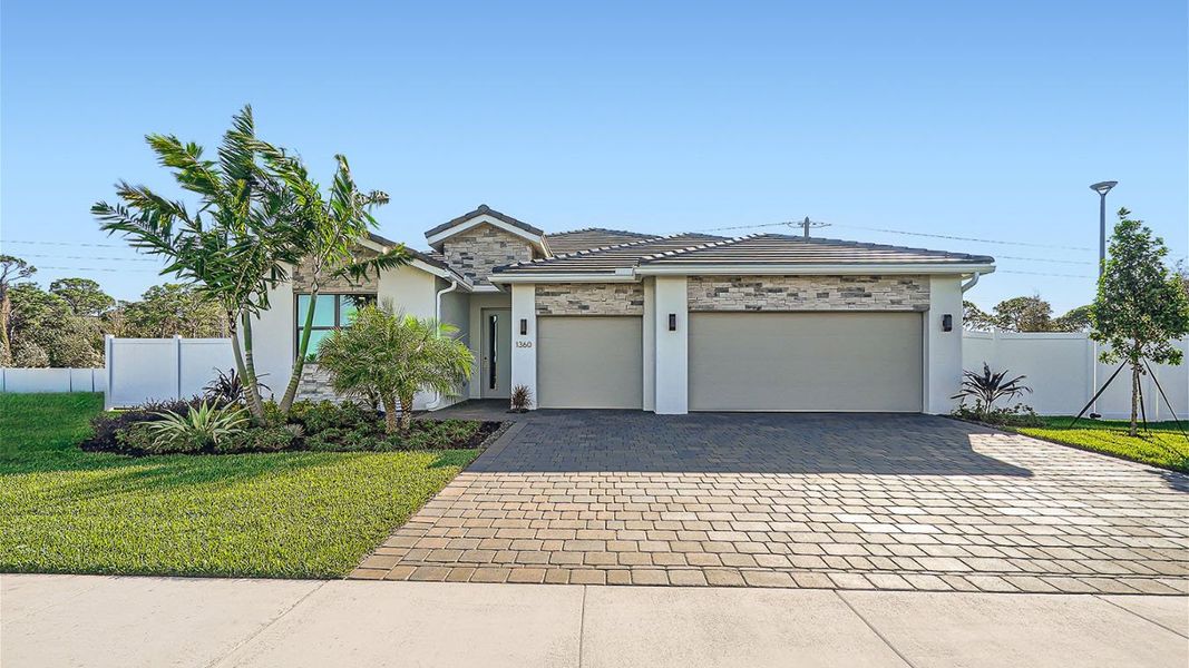 Representative exterior photo of a completed home built from the Camden by D.R. Horton in Estrella Square, Homestead, FL (Image 2).